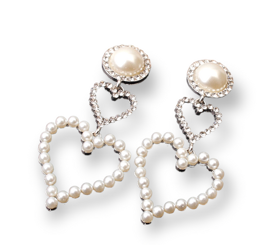 Pearla Loves Her Earrings featuring luminous pearls with a romantic, stylish design, perfect for elegant and casual outfits.