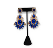 A pair of earrings with blue and white gold pearls, and cubic zirconia embellishments.