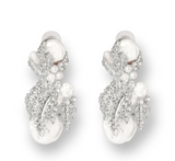 Elegant Pearls & Décor Earrings featuring lustrous pearls with decorative accents, perfect for formal or casual outfits.